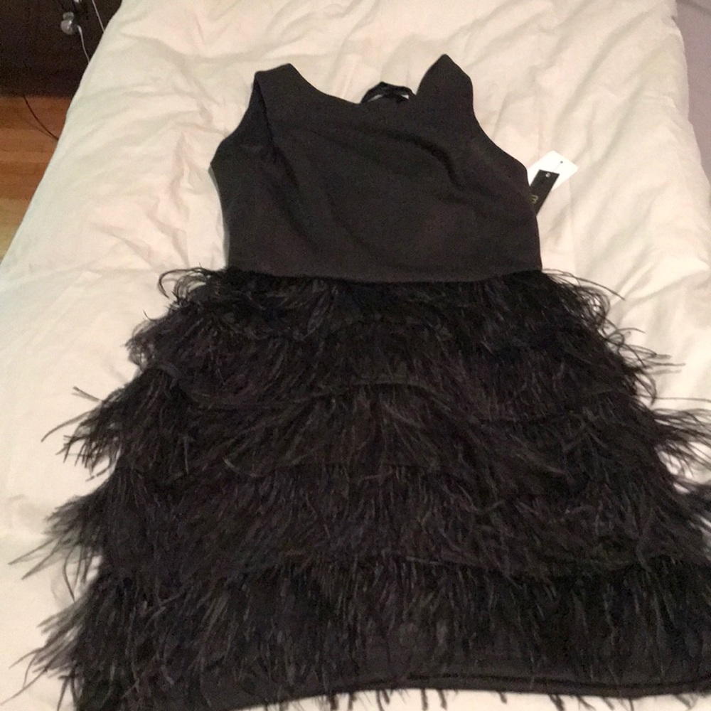 Little black dress with on trend feathers